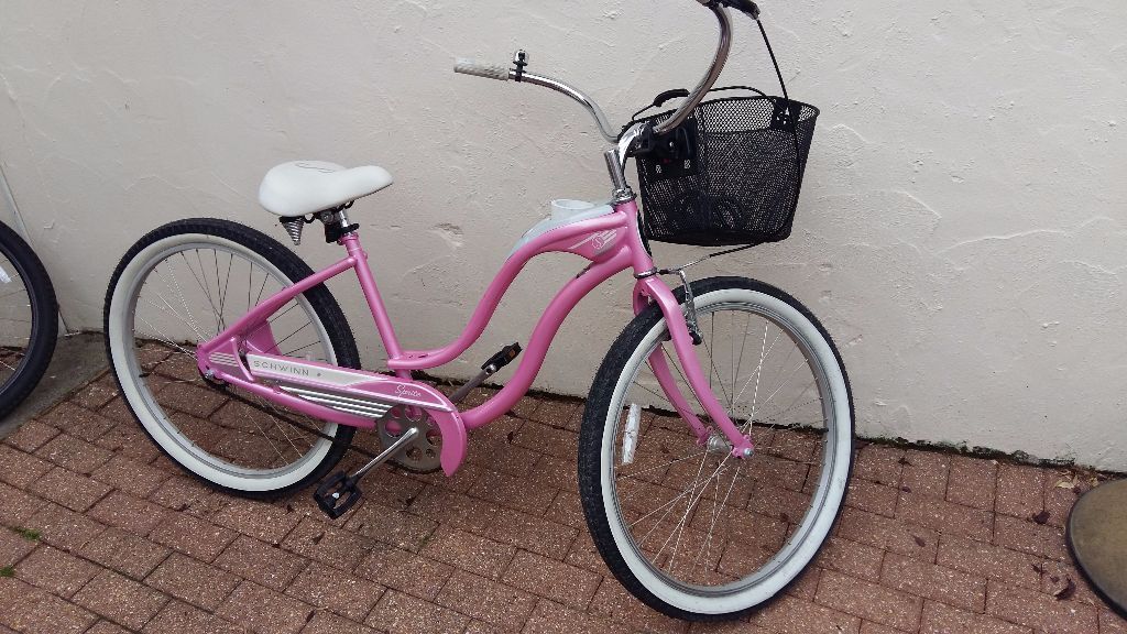 pink beach cruiser with basket